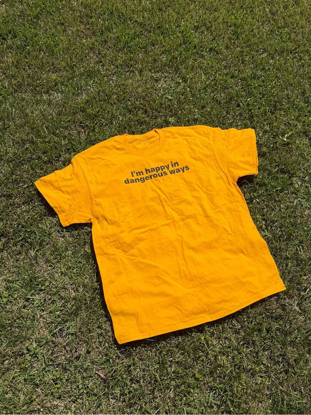 Yellow Graphic Tee "I'm happy in dangerous ways"